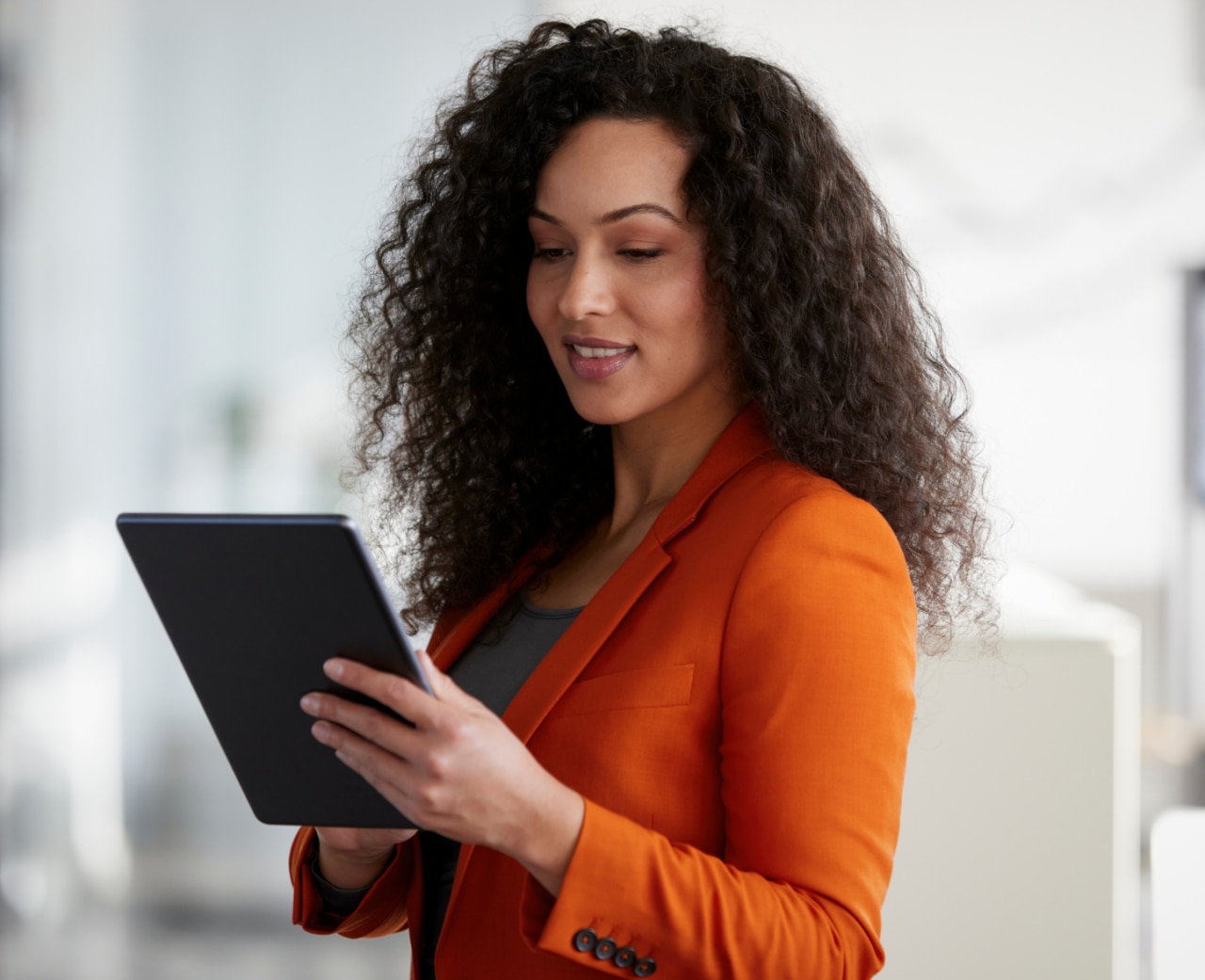 A female holding a tablet